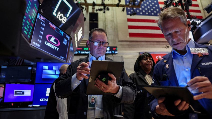 Traders work on the floor at the New York Stock Exchange in New York City, U.S., March 24, 2025.