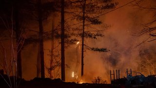 The Black Cove Fire burns on Wednesday, March 26, 2025, in Saluda, N.C.