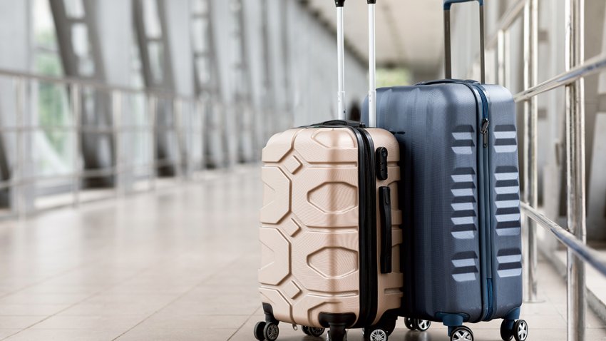 Travel Fashion. Closeup Shot Of Two Plastic Suitcases Standing At Empty Airport Corridor, Stylish Luggage Bags Waiting At Terminal Hall, Banner For Air Travelling And Vacation Booking Concept