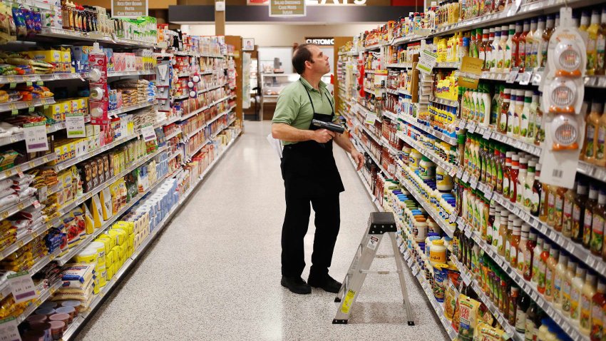 Grocery clerk James Delarosa takes inventory of the salad dressing and condiments aisle at a Publix Super Markets Inc. grocery store in Knoxville, Tennessee.