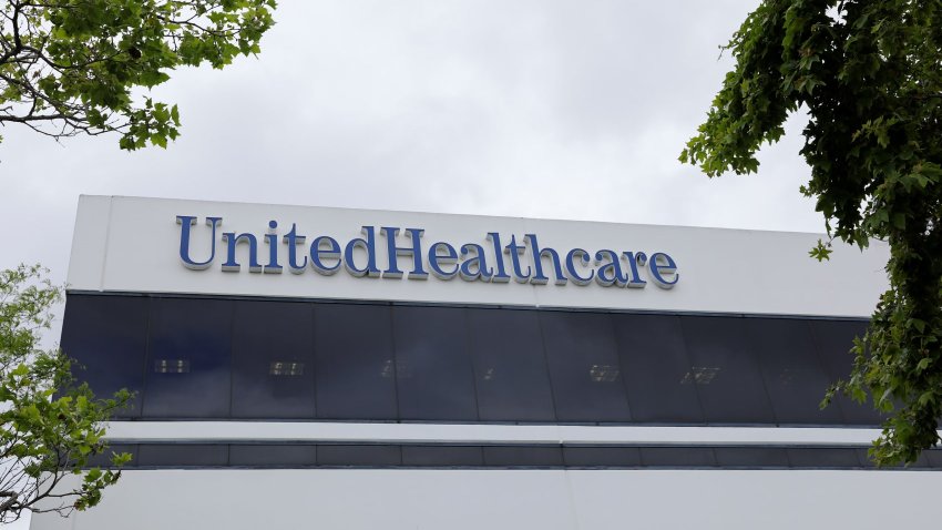 The logo of UnitedHealth appears on the side of one of its office buildings in Santa Ana, California, on April 13, 2020.