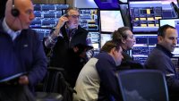 Traders work on the floor of the New York Stock Exchange (NYSE) at the opening bell on April 10, 2025, in New York City.