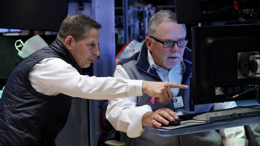 Traders work on the floor at the New York Stock Exchange (NYSE) in New York City, U.S., April 15, 2025.