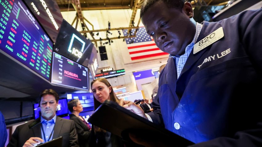 Traders work on the floor at the New York Stock Exchange (NYSE) in New York City, U.S., April 17, 2025.
