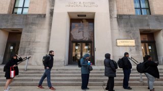 Employees of the Department of Health and Human Services (HHS) queue outside the Mary E. Switzer Memorial Building, after it was reported that the Trump administration fired staff at the Centers for Disease Control and Prevention and at the Food and Drug Administration, as it embarked on its plan to cut 10,000 jobs at HHS, in Washington, D.C., U.S., April 1, 2025.