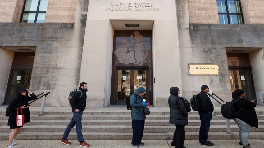 Employees of the Department of Health and Human Services (HHS) queue outside the Mary E. Switzer Memorial Building, after it was reported that the Trump administration fired staff at the Centers for Disease Control and Prevention and at the Food and Drug Administration, as it embarked on its plan to cut 10,000 jobs at HHS, in Washington, D.C., U.S., April 1, 2025.