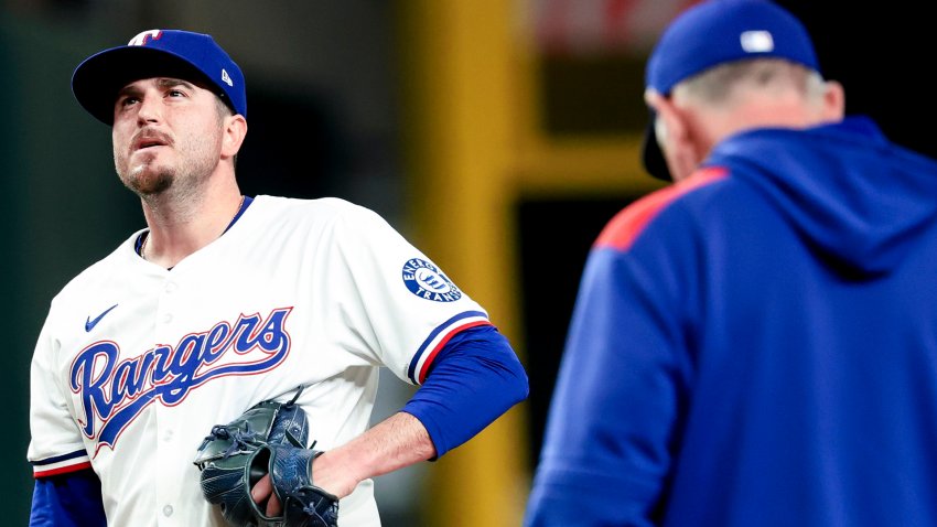 Apr 30, 2025; Arlington, Texas, USA;  Texas Rangers relief pitcher Luke Jackson (77) reacts as Texas Rangers manager Bruce Bochy (15) pulls him during the ninth inning against the Oakland Athletics at Globe Life Field.