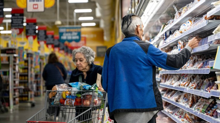 Customers shop for produce at an H-E-B grocery store on Feb. 12, 2025 in Austin, Texas.