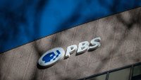 A sign for the Public Broadcasting Service (PBS) is seen on its building headquarters on Feb. 18, 2025 in Arlington, Virginia.