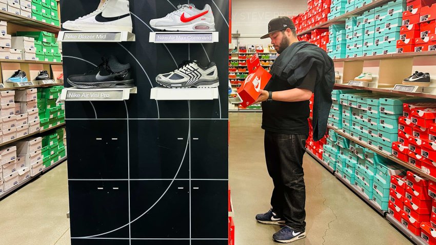 A man shops for shoes at a Nike outlet store in Los Angeles, California on April 10, 2025.