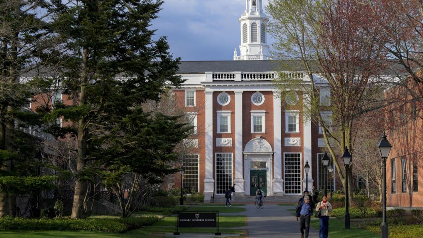 FILE PHOTO: People walk on the Business School campus of Harvard University in Cambridge, Massachusetts, U.S., April 15, 2025.