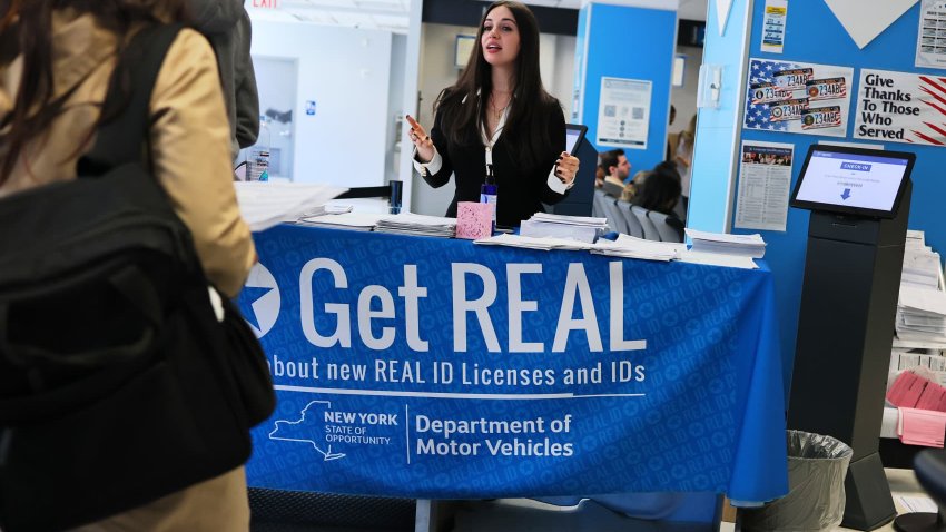 An employee checks people in at the New York State DMV on April 28, 2025 in New York City.