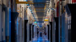 People walk through the hallways at Equinix Data Center in Ashburn, Virginia, on May 9, 2024.