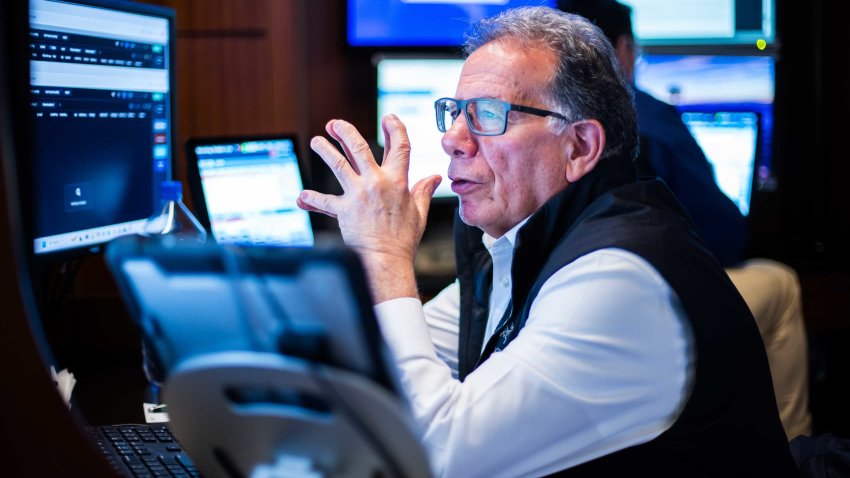 Traders work on the floor of the New York Stock Exchange on May 1, 2025.