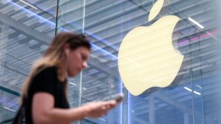 A person walks by the Apple store on Fifth Avenue in New York City, U.S., May 1, 2025.