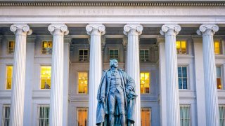 The statue of former Treasury Secretary Albert Gallatin stands in front of the north wing of the U.S. Treasury Department headquarters building on April 24, 2025, in Washington, DC, U.S.