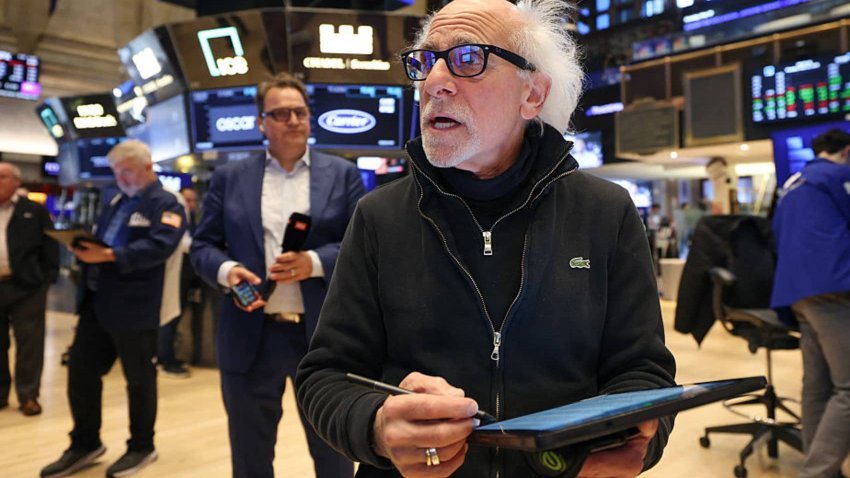 A trader works on the floor of the New York Stock Exchange at the opening bell on May 19, 2025.