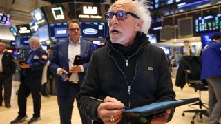 A trader works on the floor of the New York Stock Exchange at the opening bell on May 19, 2025.