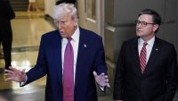 U.S. President Donald Trump gestures next to U.S. House Speaker Mike Johnson (R-LA), on the day of a closed House Republican Conference meeting on Capitol Hill in Washington, D.C., U.S., May 20, 2025.