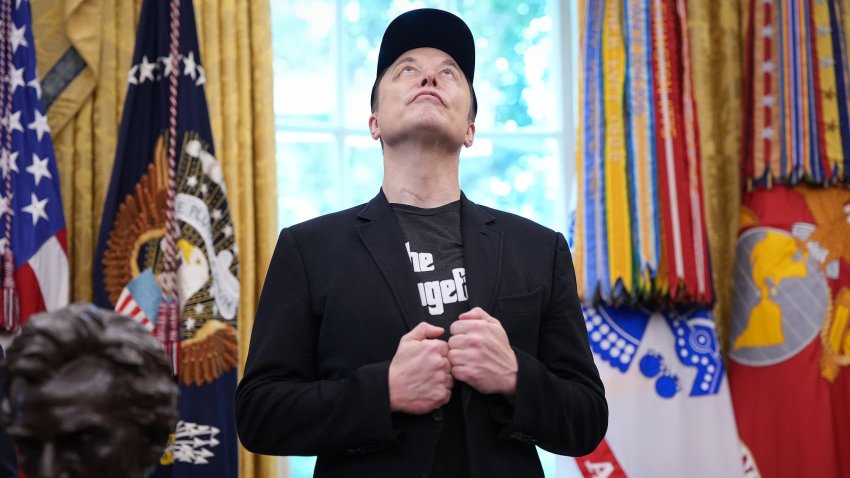 Tesla CEO Elon Musk looks up as he listens to U.S. President Donald Trump speak to reporters in the Oval Office of the White House on May 30, 2025 in Washington, DC.