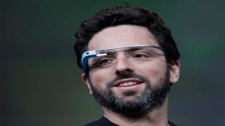 Google co-founder Sergey Brin demonstrates Google’s new Glass, wearable internet glasses, at the Google I/O conference in San Francisco, Wednesday, June 27, 2012.  The audience got live video feeds from their glasses as they descended to land on the roof of the Moscone Center, the location of the conference. (AP Photo/Paul Sakuma)