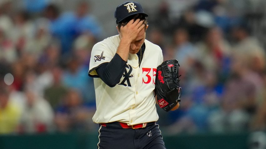 Texas Rangers starting pitcher Jack Leiter reacts between pitches against the Seattle Mariners during the first inning of a baseball game Friday, May 2, 2025, in Arlington, Texas. (AP Photo/Julio Cortez)