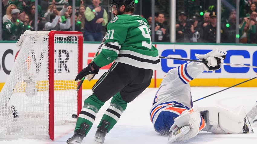 Dallas Stars center Tyler Seguin (91) scores a goal against Edmonton Oilers goaltender Stuart Skinner (74) during the first period in Game 1 of the Western Conference finals in the NHL hockey Stanley Cup playoffs against the Dallas Stars, Wednesday, May 21, 2025, in Dallas. (AP Photo/LM Otero)