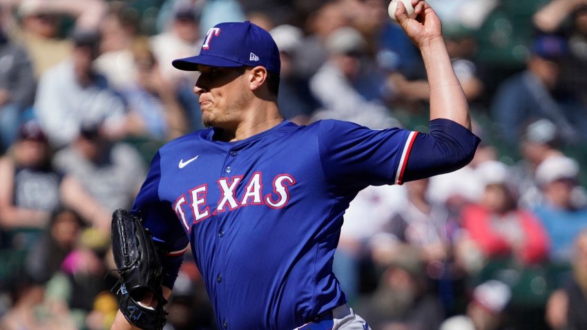 Texas Rangers pitcher Robert Garcia throws against the Chicago White Sox during the ninth inning of a baseball game Sunday, May 25, 2025, in Chicago. (AP Photo/David Banks)