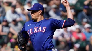 Texas Rangers pitcher Robert Garcia throws against the Chicago White Sox during the ninth inning of a baseball game Sunday, May 25, 2025, in Chicago. (AP Photo/David Banks)