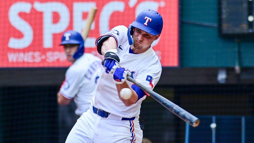 Texas Rangers’ Corey Seager swings at a pitch during the fourth inning of a baseball game against the St. Louis Cardinals, Saturday, May 31, 2025, in Arlington, Texas. (AP Photo/Ronaldo Bolaños)