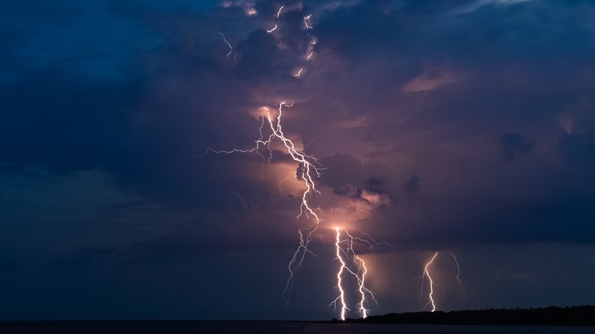 Dramatic lightning thundertbolt bolt strikes at night, bad weather,dark sky