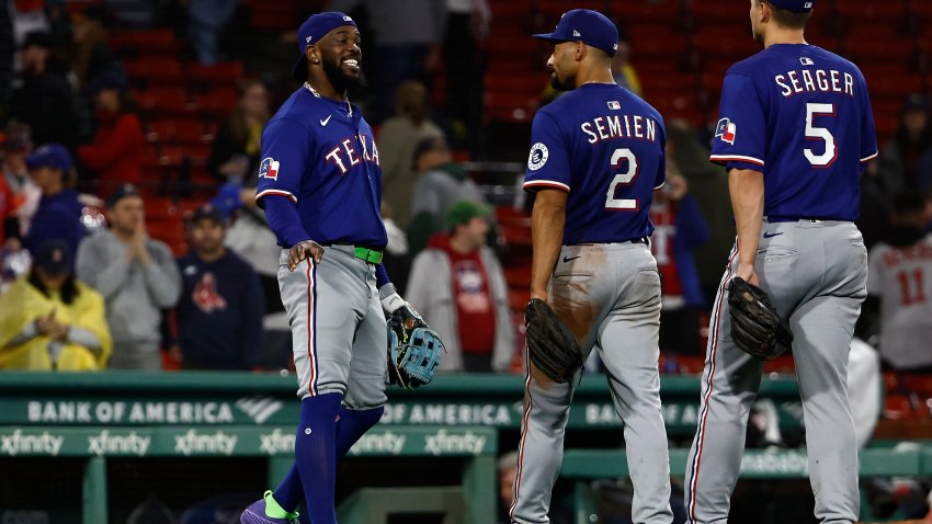 BOSTON, MA – MAY 6: Adolis García #53 of the Texas Rangers smiles at Marcus Semien #2 and Corey Seager #5 after a 6-1 win over the Boston Red Sox at Fenway Park on May 6, 2025 in Boston, Massachusetts.