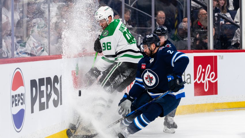 WINNIPEG, CANADA – MAY 7: Mikko Rantanen #96 of the Dallas Stars protects the puck against the Winnipeg Jets during the third period of Game One of the Second Round in the 2025 Stanley Cup Playoffs at Canada Life Centre on May 7, 2025 in Winnipeg, Canada. (Photo by Cameron Bartlett/Getty Images)