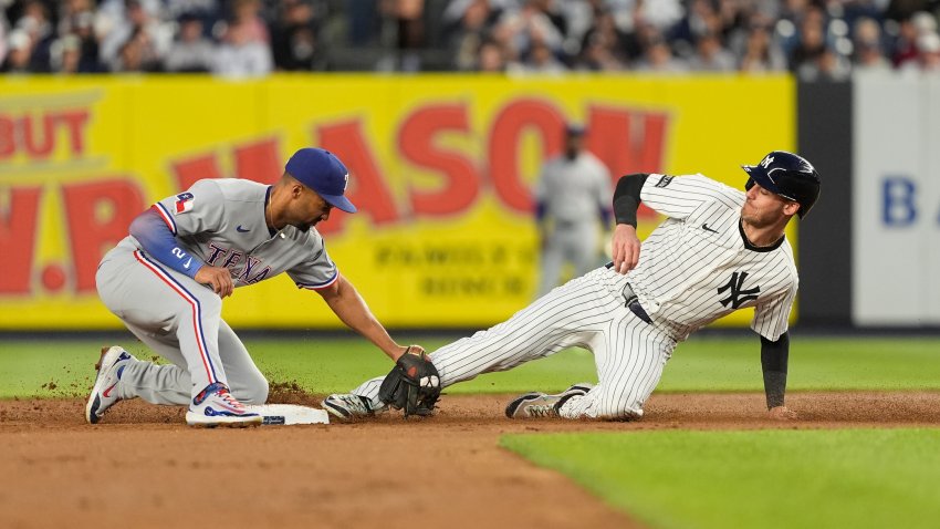 BRONX, NY – MAY 20: Texas Rangers Second Baseman Marcus Semien (2) tags out New York Yankees Left Fielder Cody Bellinger (35) attempting to steal second base during the fourth inning to the Major League Baseball game between the Texas Rangers and the New York Yankees on May 20, 2025, at Yankee Stadium in The Bronx, NY.