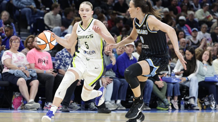 CHICAGO, ILLINOIS – MAY 29: Paige Bueckers #5 of the Dallas Wings dribbles against Rebecca Allen #9 of the Chicago Sky in the first half at Wintrust Arena on May 29, 2025 in Chicago, Illinois.