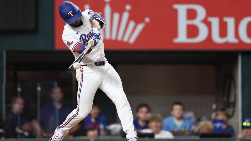ARLINGTON, TEXAS – MAY 27: Marcus Semien #2 of the Texas Rangers singles during the fifth inning against the Toronto Blue Jays at Globe Life Field on May 27, 2025 in Arlington, Texas.