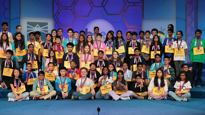 NATIONAL HARBOR, MARYLAND – MAY 28: Spellers sit for a photograph with their newly awarded medals for making it into the semifinals of the 2025 Scripps National Spelling Bee at the Gaylord National Resort and Convention Center on May 28, 2025 in National Harbor, Maryland. 243 spellers from all over the globe ages 8 to 14 compete from May 27-May 30, 2025 during the 100th anniversary of the bee.