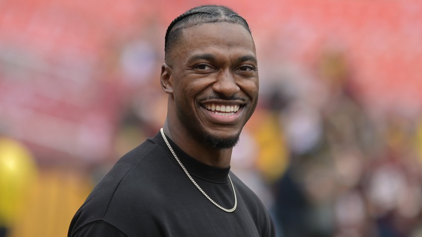 Sep 10, 2023; Landover, Maryland, USA; Robert Griffin III, former professional football quarterback, walks on the field before the game between the Washington Commanders and the Arizona Cardinals at FedExField.