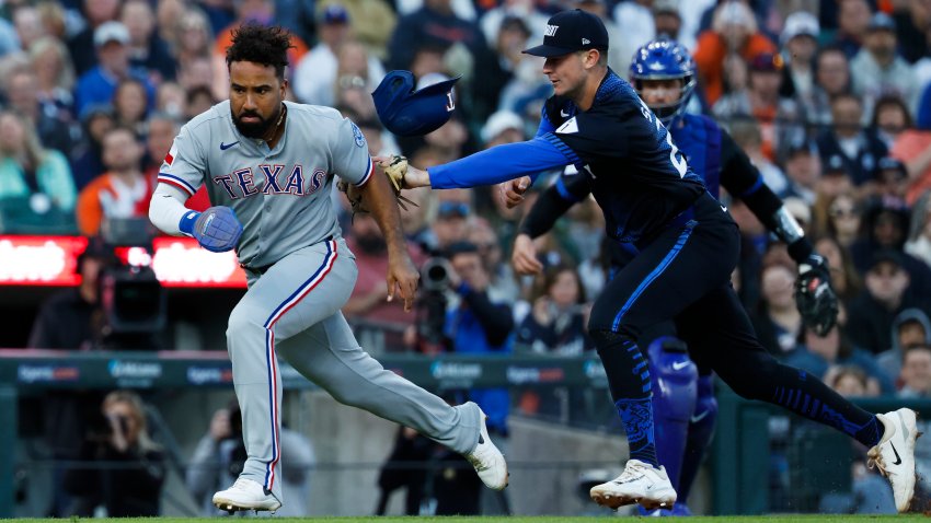 May 9, 2025; Detroit, Michigan, USA;  Detroit Tigers shortstop Trey Sweeney (27) tags out Texas Rangers designated hitter Ezequiel Duran (20) in the sixth inning against the Texas Rangers at Comerica Park. Mandatory Credit: Rick Osentoski-Imagn Images