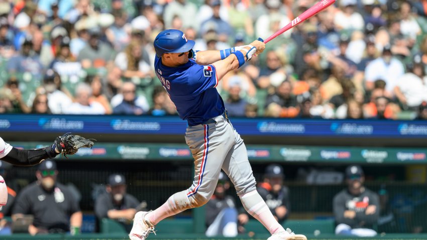 May 11, 2025; Detroit, Michigan, USA; Texas Rangers third baseman Josh Jung (6) hits a two-run home run against the Detroit Tigers in the fifth inning at Comerica Park. Mandatory Credit: Lon Horwedel-Imagn Images