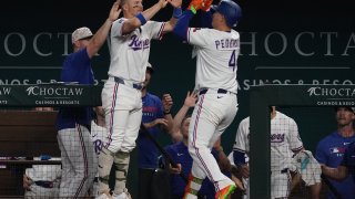 May 17, 2025; Arlington, Texas, USA; Texas Rangers first baseman Joc Pederson (4) is greeted by third baseman Josh Jung (6) after hitting a two-run home run sixth inning against the Houston Astros at Globe Life Field. Mandatory Credit: Raymond Carlin III-Imagn Images