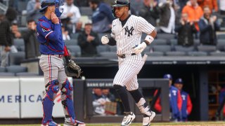 May 22, 2025; Bronx, New York, USA; New York Yankees second baseman Jorbit Vivas (90) scores after hitting a solo home run during the fifth inning against the Texas Rangers at Yankee Stadium. Mandatory Credit: Vincent Carchietta-Imagn Images
