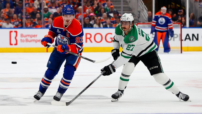 May 25, 2025; Edmonton, Alberta, CAN; Edmonton Oilers center Ryan Nugent-Hopkins (93) and Dallas Stars left wing Mason Marchment (27) chase the puck during the third period in game three of the Western Conference Final of the 2025 Stanley Cup Playoffs at Rogers Place.