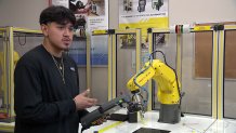 A student at Dallas College works with robotics, April 2025.