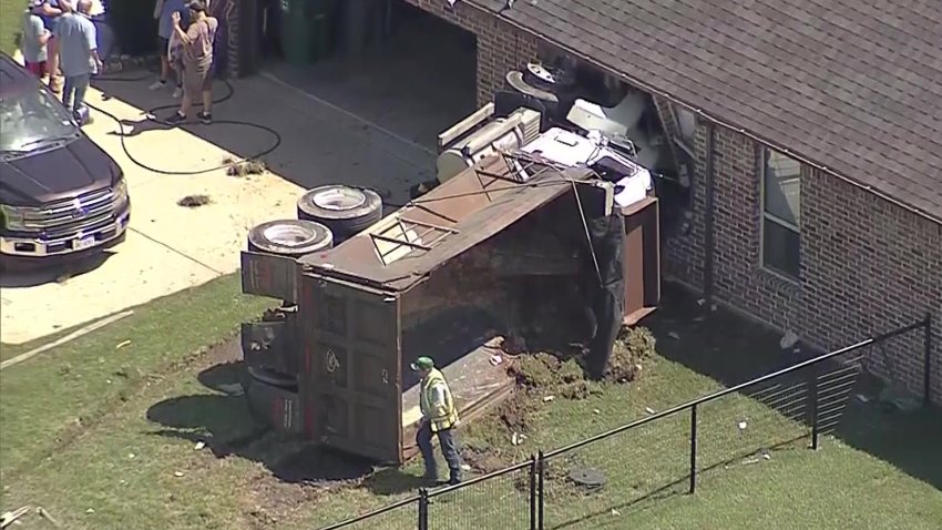 A dump truck crashed into a home in Tarrant County, Texas, Friday, May 30, 2025.