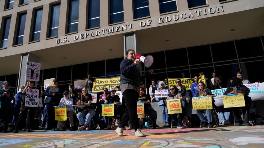 A demonstrator speaks through a megaphone during a Defend Our Schools rally to protest U.S. President Donald Trump’s executive order to shut down the U.S. Department of Education, outside its building in Washington, D.C., U.S., March 21, 2025.