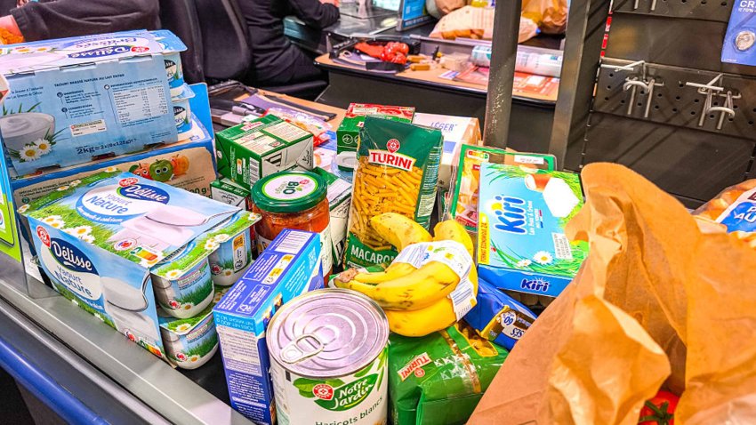 Illustration of food items placed on the belt of a cash register in a Leclerc supermarket in Valence, France, April 4, 2025.