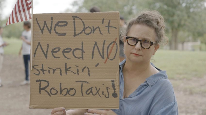 Blythe Christopher attends a demonstration to protest Tesla robotaxis on June 12, 2025 in Austin, Texas.
