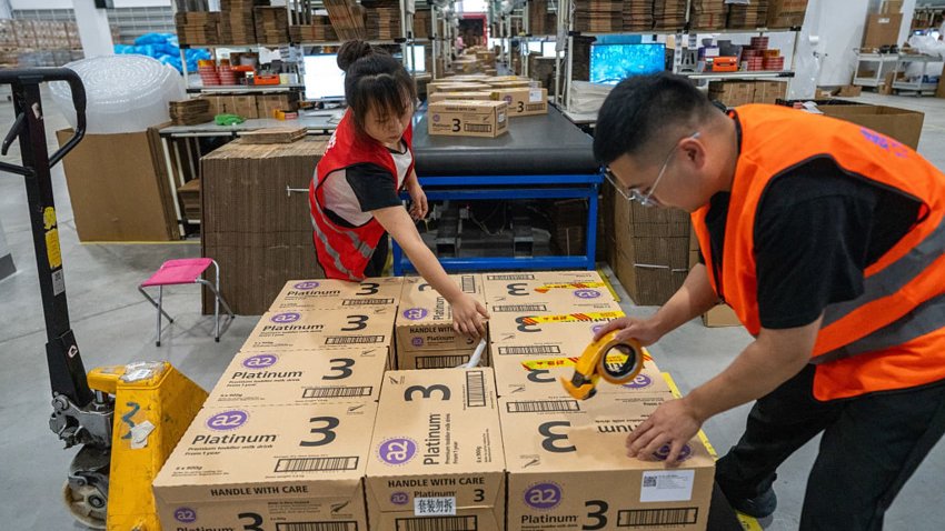 JINHUA, CHINA – JUNE 16: Employees of a cross-border e-commerce enterprise sort and package express parcels in preparation for the 618 Shopping Festival on June 16, 2025 in Jinhua, Zhejiang Province of China. (Photo by Yang Meiqing/VCG via Getty Images)