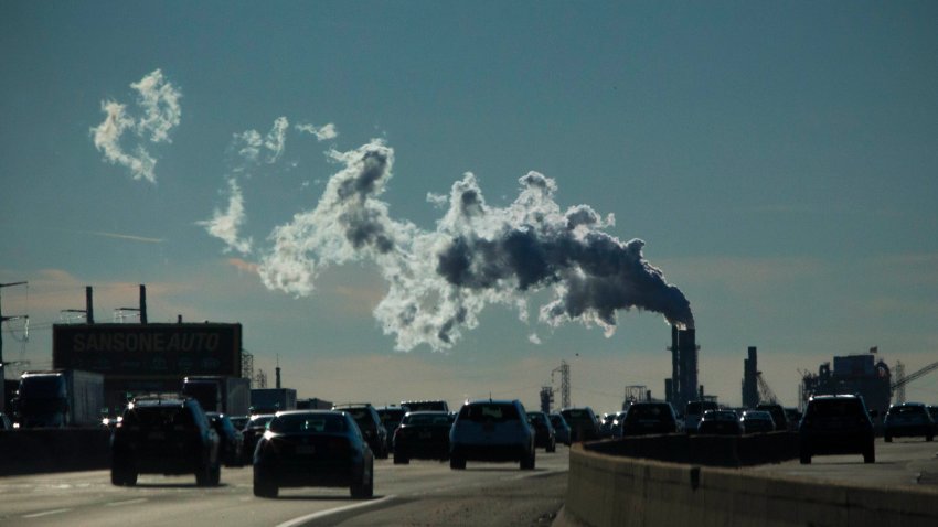Vehicles move along the The New Jersey Turnpike Way while a Factory emits smoke on Nov.  17, 2017 in New Jersey.